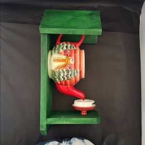 Handcrafted Green and Red Ceramic Teapot bird feeder.